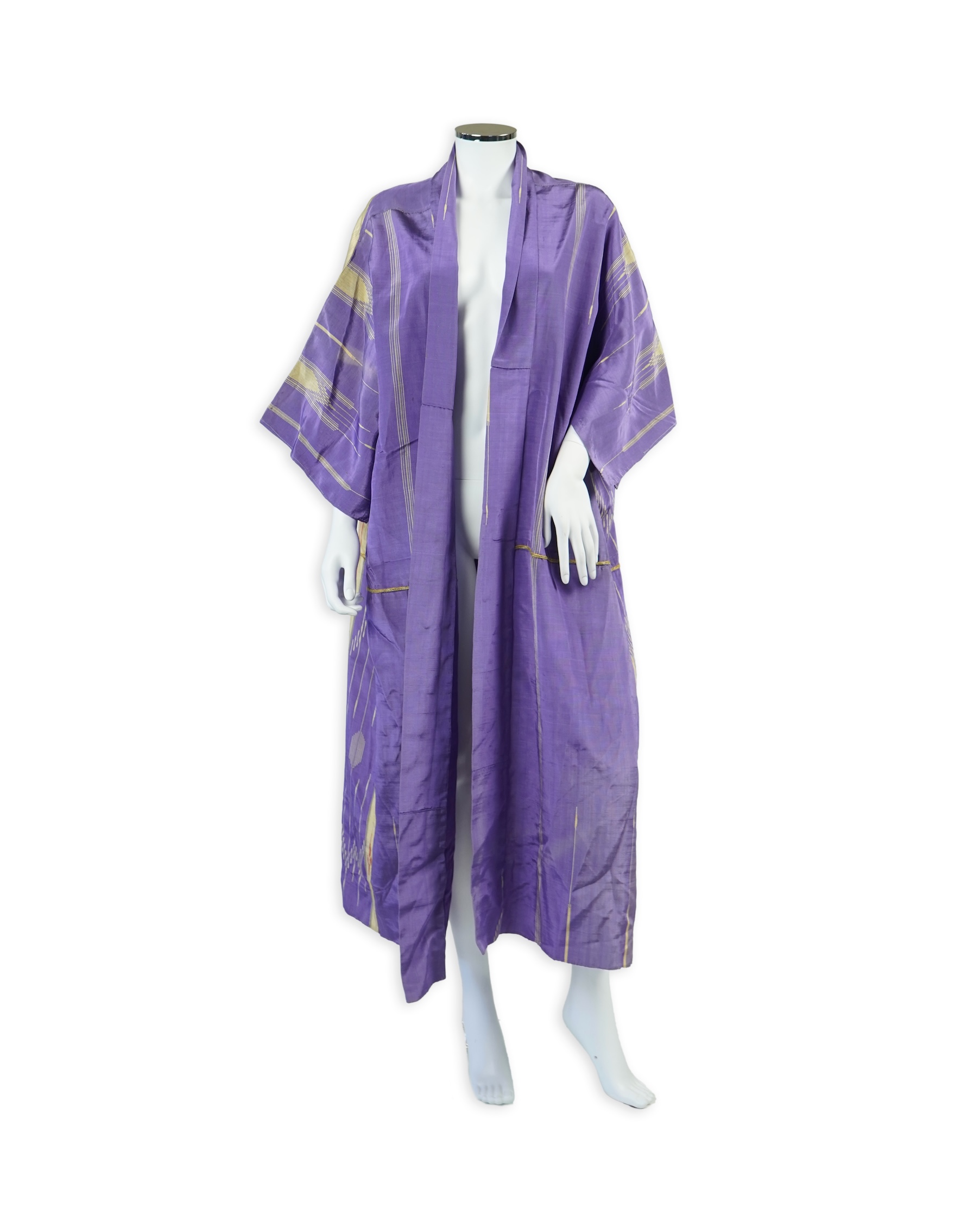An early 20th century Syrian hand woven silk coat. Woven with stripes and geometric shapes in purple and yellow and red., 130 cm long. Condition - good, colours and fabric strong.